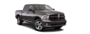 A grey 2018 Ram 1500 is facing right.