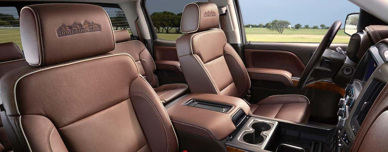 The brown leather interior of a 2018 Chevrolet Silverado is shown.