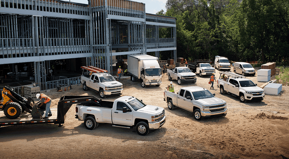 Chevy Vans and Commercial Trucks at a worksite