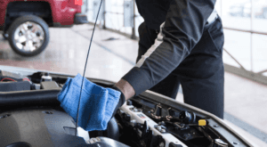 A mechanic is doing an oil change in a Cincinnati, OH service center.