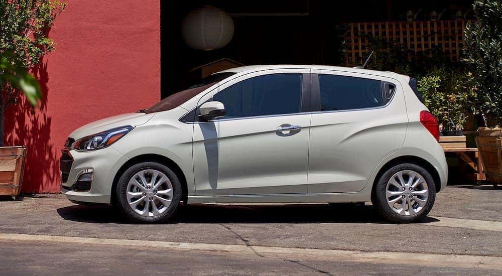 A white 2019 Chevy Spark is shown from the side.