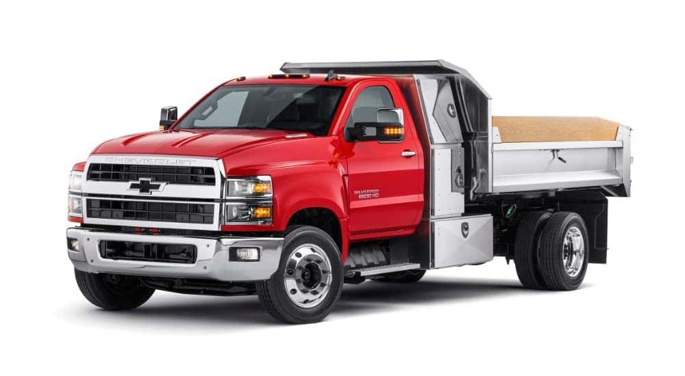 Red 2019 Chevrolet Silverado dump truck on white background