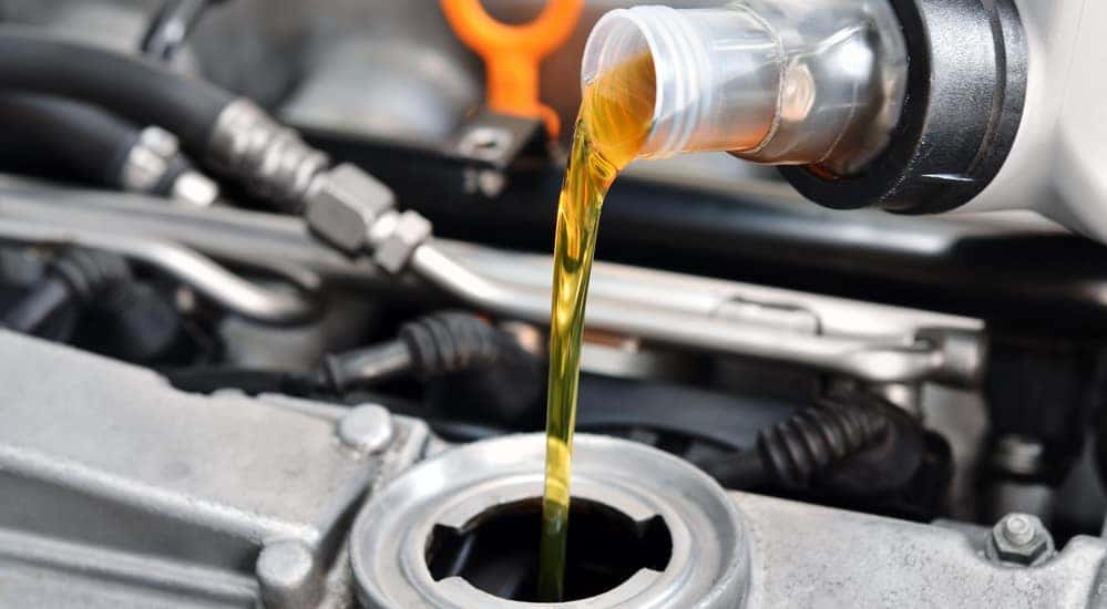 Oil being poured into motor