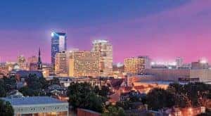 The Lexington Kentucky Skyline is shown at dusk.