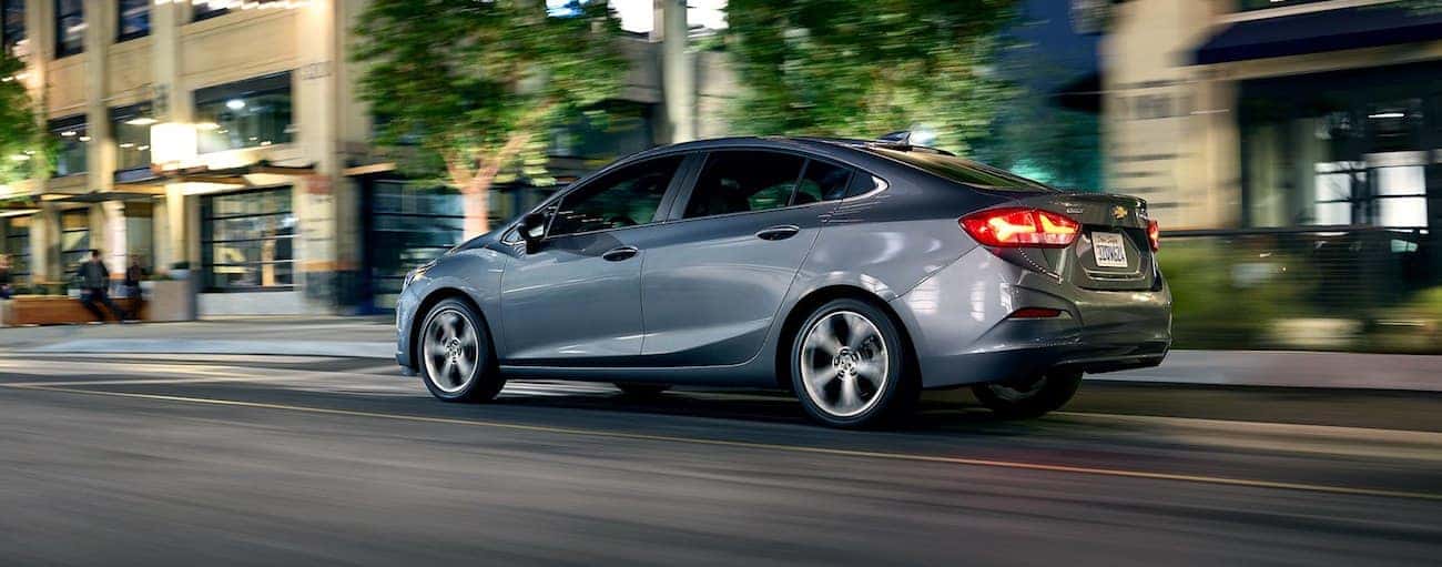 Gray 2019 Chevy Cruze driving on city road