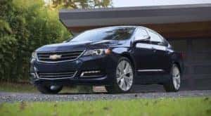 A blue 2019 Chevy Impala outside a Dayton Ohio home