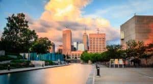 The Indianapolis skyline is shown at dusk.