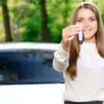A woman happy with her new car from a Buy Here Pay Here in Louisville is shown.