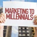 Millennial marketing sign being held up