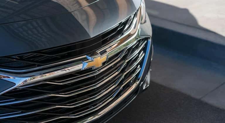 The front of a black 2019 Chevy Malibu is featured.