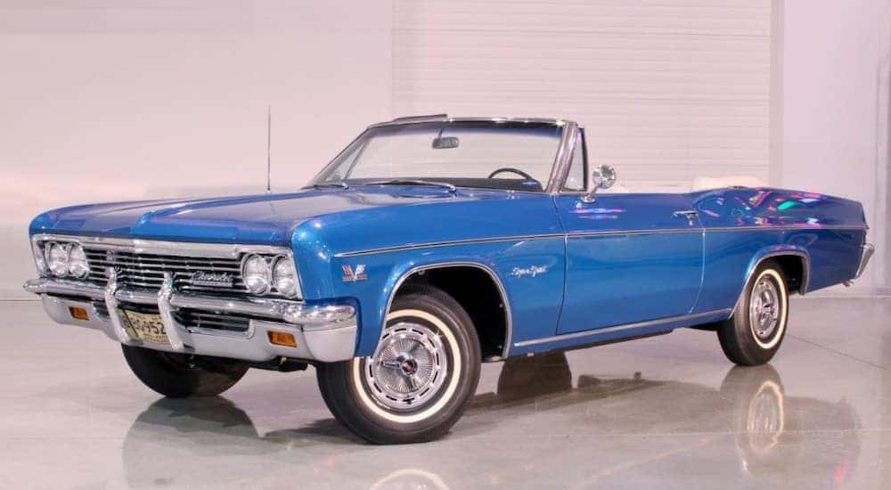 A blue 1966 Chevy Impala SS1 is parked in a showroom - Cincinnati, OH