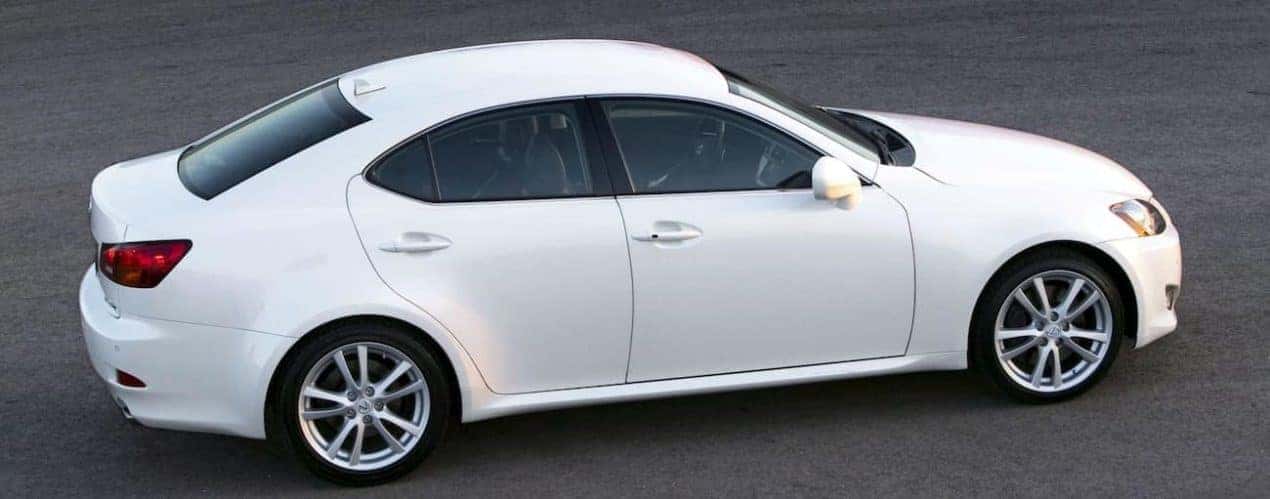 A white 2007 used Lexus IS is parked on pavement in Cincinnati, OH facing right.