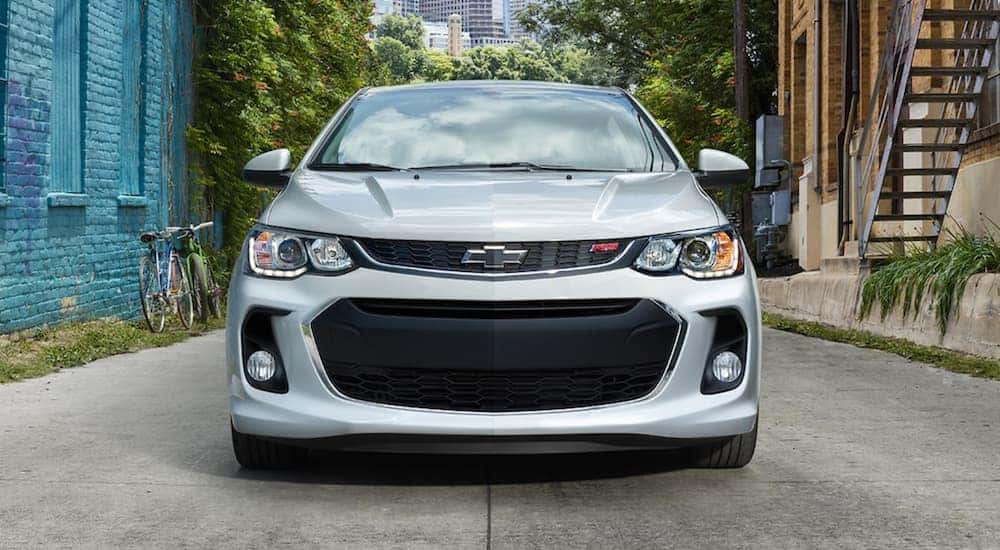 A silver 2019 Chevy Sonic is in an alley. Find yours by searching 'Chevy dealers Dayton" in Ohio.