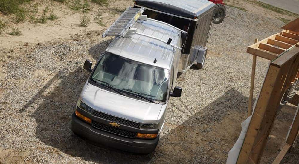 A 2019 Chevy Express Cargo Van is at a construction site, and you can find vans and dump trucks for sale in Cincinnati, OH.