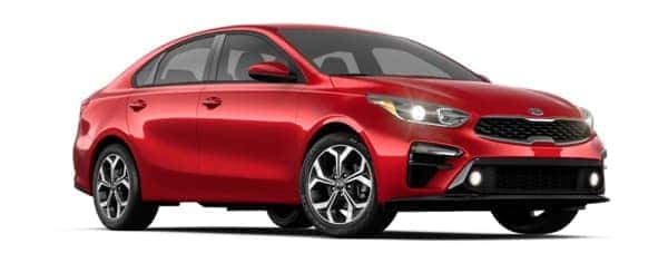 A red 2019 Kia Forte is facing right.