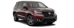 A burgundy 2019 Honda Passport facing right.