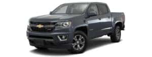 A dark blue 2017 Chevy Colorado is facing left.