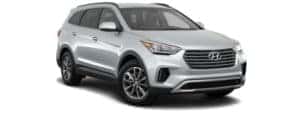 A silver 2017 Hyundai Santa Fe is facing right.