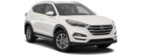 A white 2017 Hyundai Tucson is facing right.
