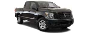 A black 2017 Nissan Titan is facing right.