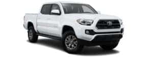 A white 2017 Toyota Tacoma is facing right.