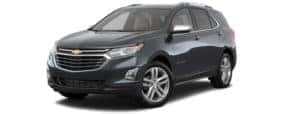 A black 2018 Chevy Equinox is facing left.