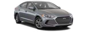A grey 2018 Hyundai Elantra is facing right.
