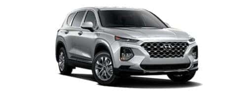 A silver 2019 Hyundai Santa Fe SE is angled right.