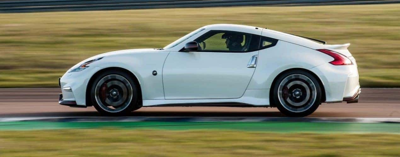 A white 2016 used Nissan 370Z is on a track.