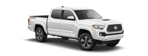A white 2019 Toyota Tacoma TRD is angled right.