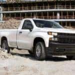 A white 2020 Chevy Silverado 1500 is parked at a construction work site near Cincinnati, OH.