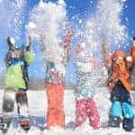 Four kids are shown playing in the snow near Dayton, Ohio.