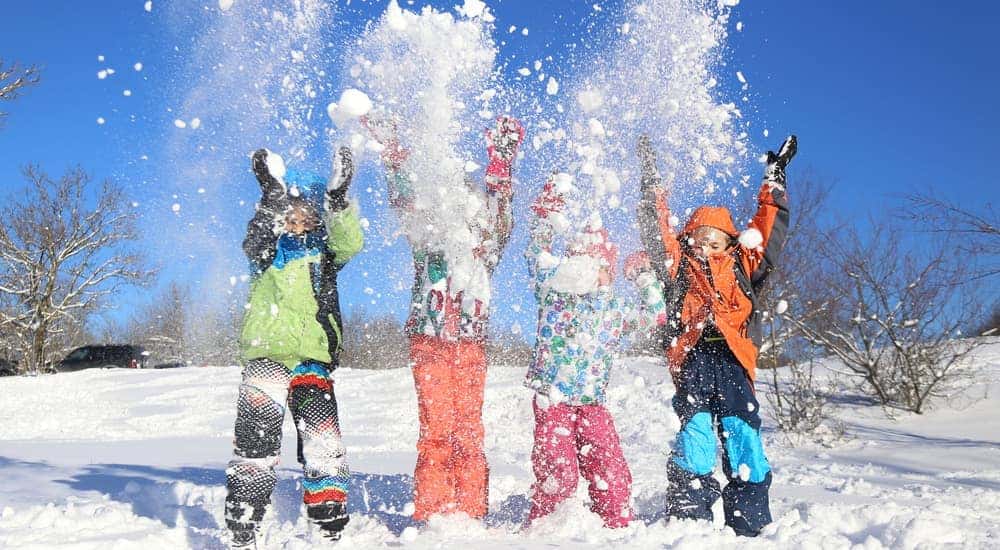 Four kids are shown playing in the snow near Dayton, Ohio.