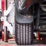 A car is at a local Cincinnati, OH tire shop getting a tire alignment.