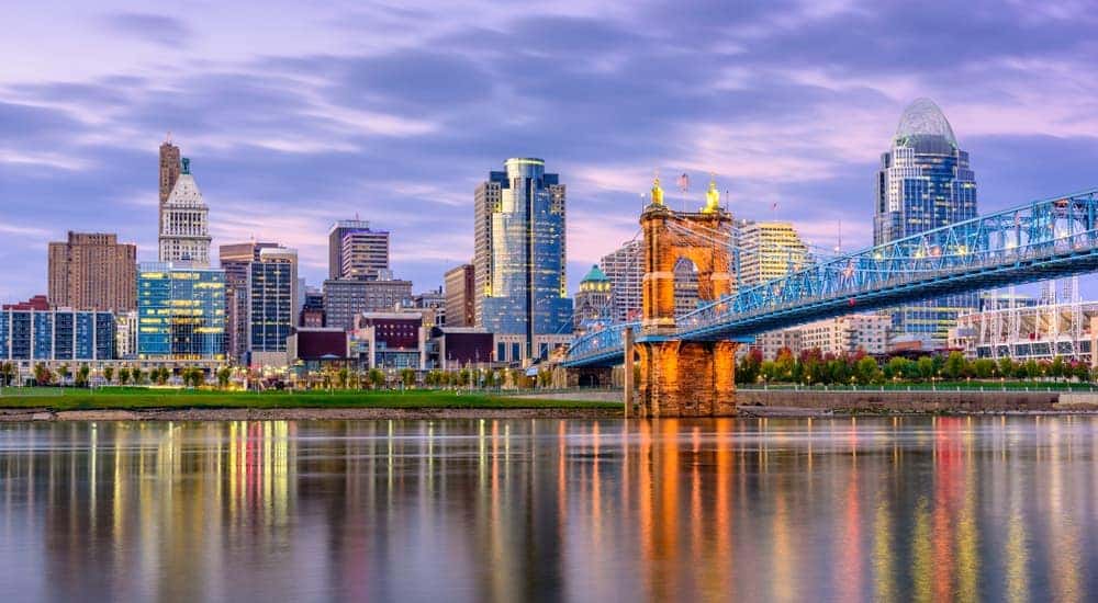 The Cincinnati, OH, skyline is shown at dusk. 