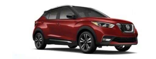 A red 2020 Nissan Kicks is angled right.
