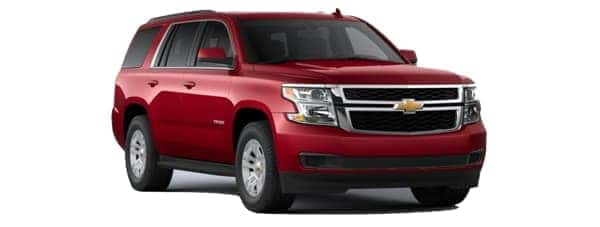 A red 2020 Chevy Tahoe is angled right.