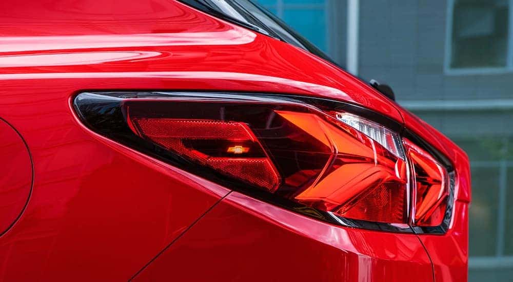 A close up of the led taillights is showing the bowtie logo on a red 2021 Chevy Blazer RS.