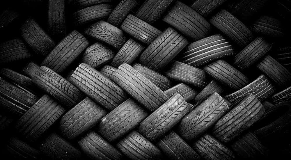 A black and white photo is showing a pile of tires.
