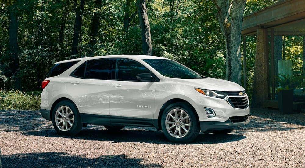 A white 2020 Chevy Equinox is parked in a gravel driveway after leaving a car dealership in Cincinnati.