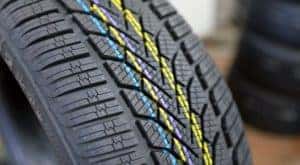 A closeup shows the treads on a Cincinnati car tire.