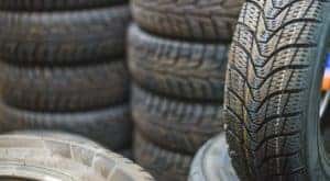 Multiple stacks of tires are shown.