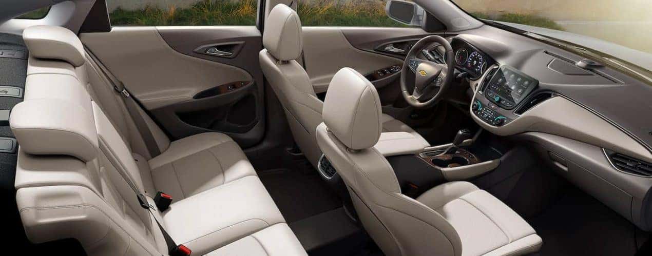 The cream interior is shown from a high angle on a 2021 Chevy Malibu.