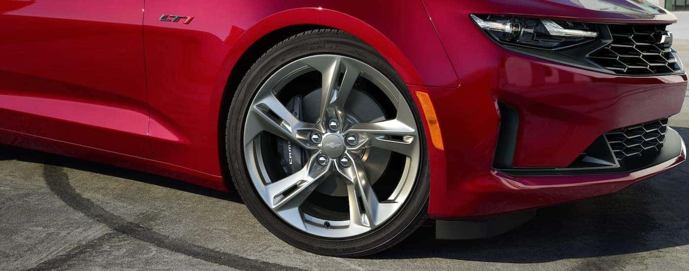 The wheel on a red 2021 Chevy Camaro is shown in closeup.