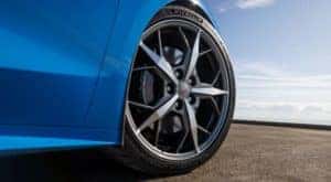 The wheel of a 2021 Chevy Corvette is shown in closeup.