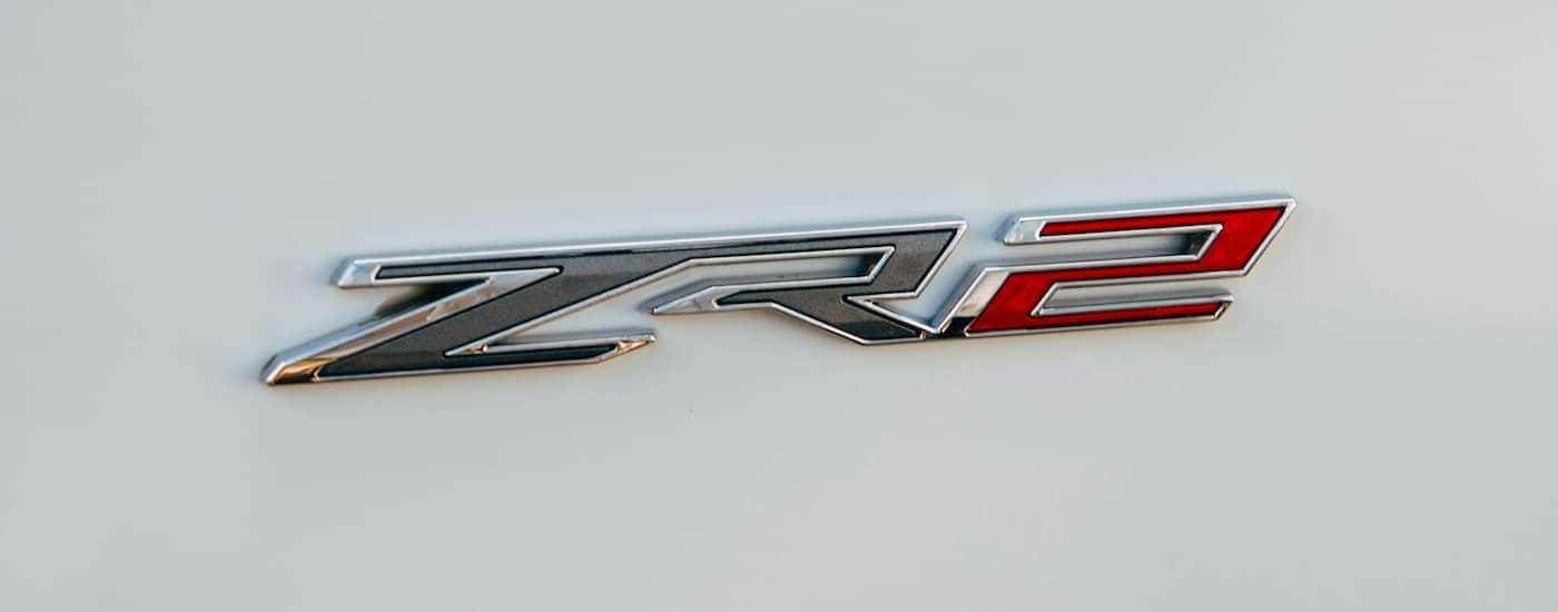 A close up shows the ZR2 badge on a white 2022 Chevy Silverado 1500 ZR2.