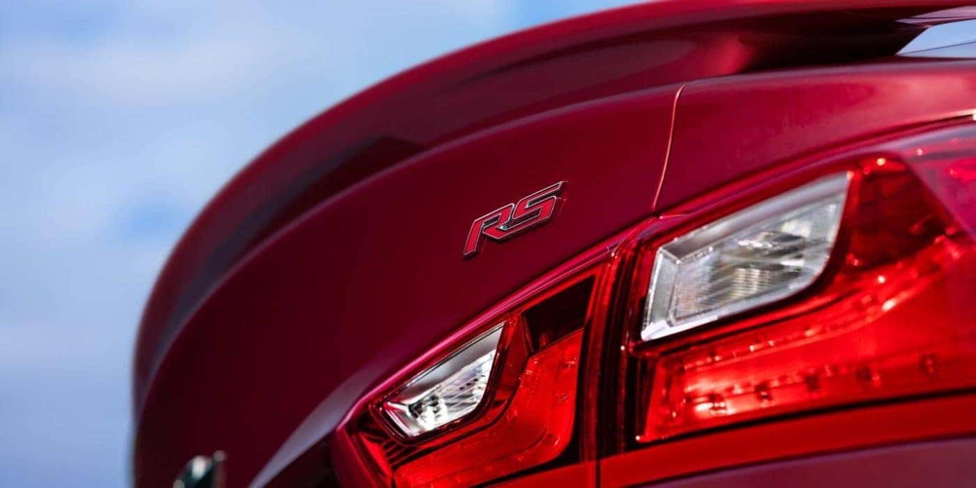 A close up shows the passenger side taillight on a red 2020 Chevy Malibu RS.