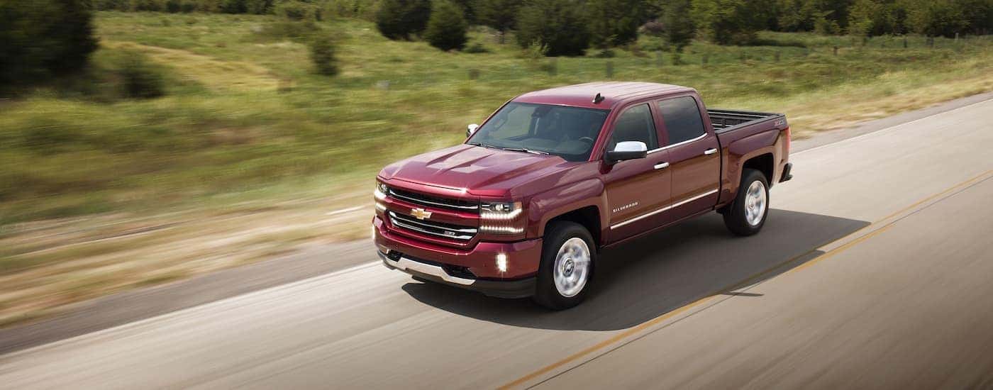 A red 2017 Chevy Silverado 1500 LTZ Z71 is shown after leaving a used car dealership in Cincinnati.