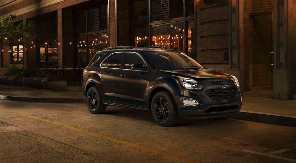 A black 2017 Chevy Equinox is shown from the front at an angle while parked on a street.