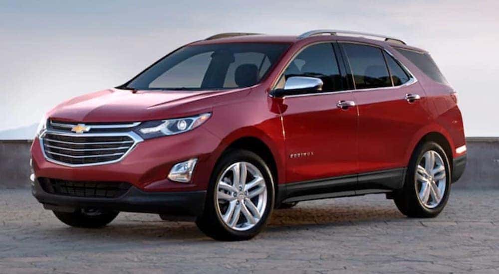 A red 2020 Chevy Equinox is shown from the front at an angle after the owner searched 'Certified Pre-Owned Chevy'.